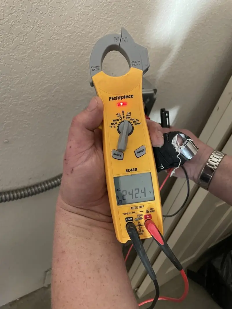 Voltage testing with clamp meter during Electrical Installation Services in North Caldwell